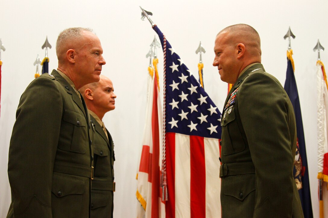 CAMP HUMPHREYS, Republic of Korea –Maj. Gen. Patrick J. Hermesmann, U.S. Marine Corps Forces Korea commander, promotes Col. Scott M. Koltick, MARFORK assistant chief of staff G-3, to his current rank here, Jan. 7. Koltick promoted to the rank of colonel after more than 24 years of faithful service. (Official U.S. Marine Corps photo)