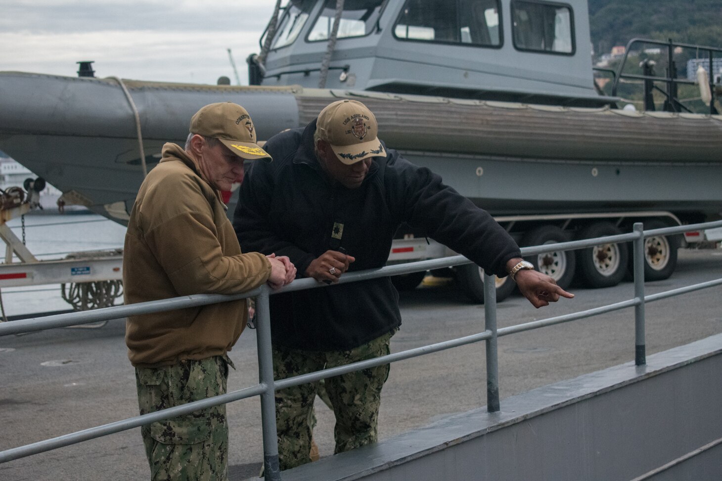 SASEBO, Japan (Jan. 9, 2019) Vice Adm. Phil Sawyer, the U.S. 7th Fleet commander, speaks with Cmdr. Patrick German, commanding officer of the amphibious dock landing ship USS Ashland (LSD 48), during a waterfront visit to forward deployed naval forces operating out of Fleet Activities Sasebo, Japan.