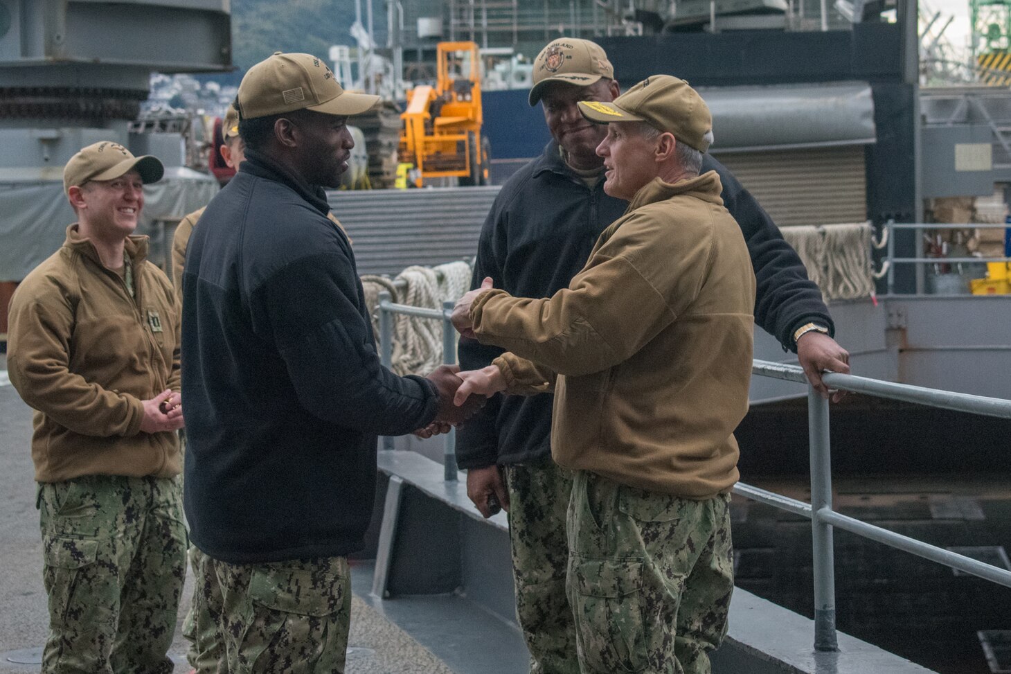 SASEBO, Japan (Jan. 9, 2019) Vice Adm. Phil Sawyer, the U.S. 7th Fleet commander, presents a coin to Boatswain’s Mate 2nd Class Walsham Morris, assigned to the amphibious dock landing ship USS Ashland (LSD 48), during a waterfront visit to forward deployed naval forces operating out of Fleet Activities Sasebo, Japan.
