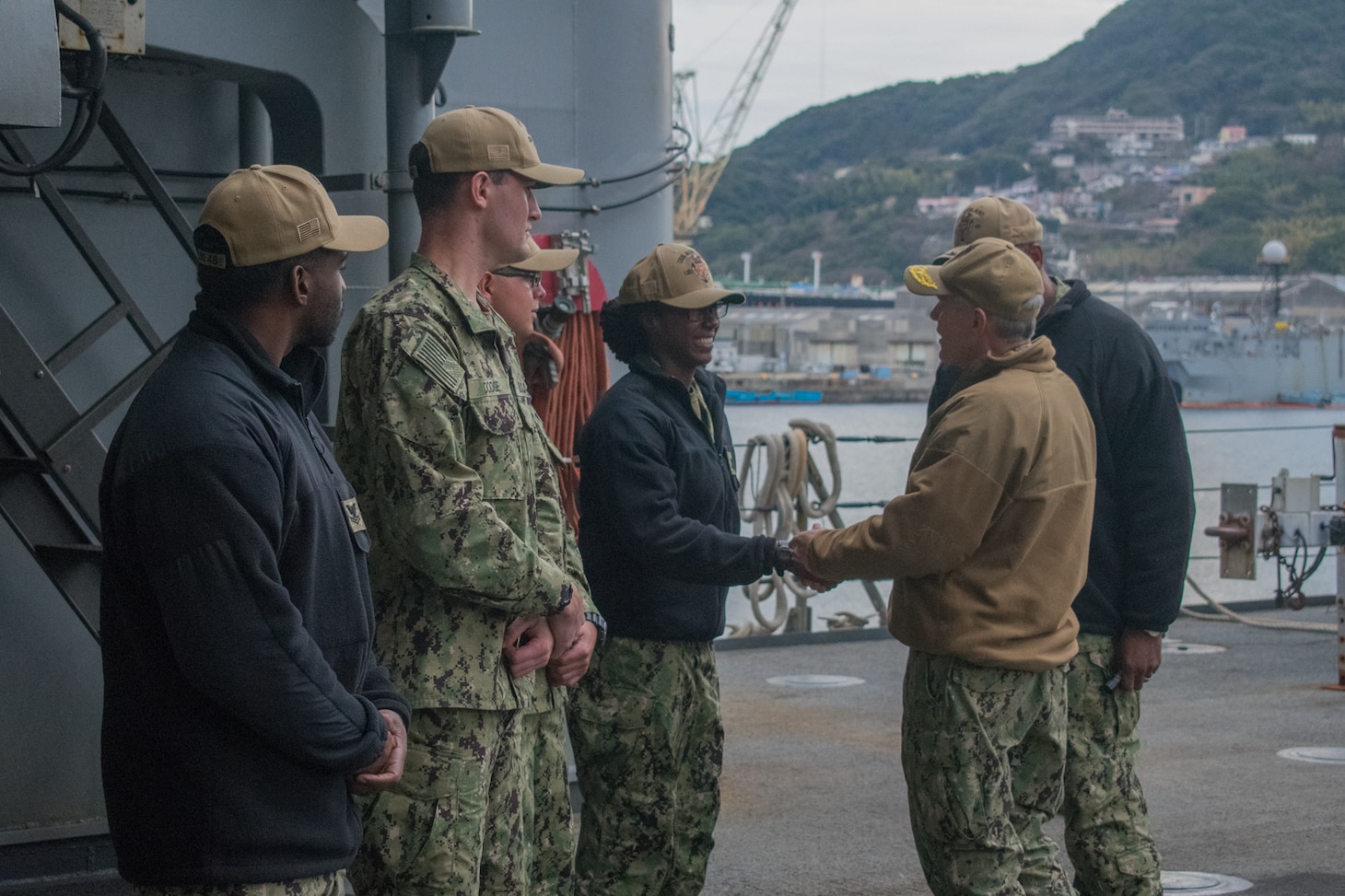 SASEBO, Japan (Jan. 9, 2019) Vice Adm. Phil Sawyer, the U.S. 7th Fleet commander, presents a coin to Culinary Specialist 3rd Class Latia Gill, assigned to the amphibious dock landing ship USS Ashland (LSD 48), during a waterfront visit to forward deployed naval forces operating out of Fleet Activities Sasebo, Japan.