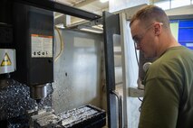 Lance Cpl. Casey Warren mills an aircraft part Jan. 9, 2019 at Camp Kinser, Okinawa, Japan. Machinists and welders with General Support Maintenance Company, 3rd Maintenance Battalion, Combat Logistics Regiment 35, 3rd Marine Logistics Group fabricate, modify and repair parts for vehicles, weapons and other accessories. Warren is a machinist with GSM Co., 3rd Maint. Bn., CLR-35, 3rd MLG. Warren is a native of Wausau, Wisconsin. (U.S. Marine Corps photo by Lance Cpl. Terry Wong)
