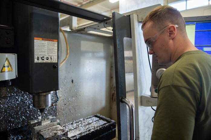 Lance Cpl. Casey Warren mills an aircraft part Jan. 9, 2019 at Camp Kinser, Okinawa, Japan. Machinists and welders with General Support Maintenance Company, 3rd Maintenance Battalion, Combat Logistics Regiment 35, 3rd Marine Logistics Group fabricate, modify and repair parts for vehicles, weapons and other accessories. Warren is a machinist with GSM Co., 3rd Maint. Bn., CLR-35, 3rd MLG. Warren is a native of Wausau, Wisconsin. (U.S. Marine Corps photo by Lance Cpl. Terry Wong)