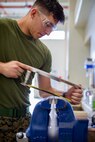 Lance Cpl. Cody McCaleb saws pegs Jan. 9, 2019 at Camp Kinser, Okinawa, Japan. Machinists and welders with General Support Maintenance Company, 3rd Maintenance Battalion, Combat Logistics Regiment 35, 3rd Marine Logistics Group fabricate, modify and repair parts for vehicles, weapons and other accessories. McCaleb is a machinist with GSM Co., 3rd Maint. Bn., CLR-35, 3rd MLG. McCaleb is a native of Corsicana, Texas (U.S. Marine Corps photo by Lance Cpl. Terry Wong)