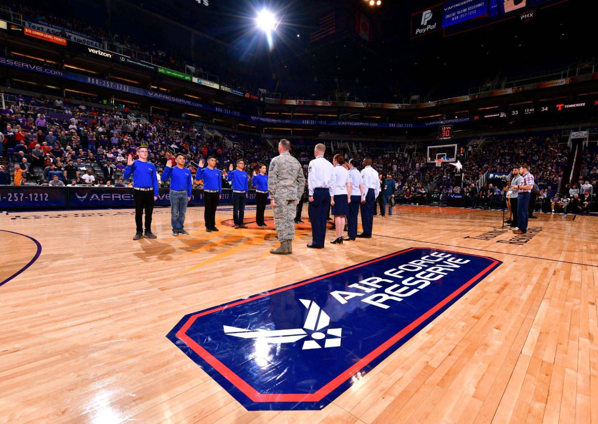 A mass enlistment was held by Team Luke at the Air Force Reserve Jerry Colangelo Classic basketball tournament in Phoenix. A group of 10 future Citizen Airman took part in the enlistment conducted by Col. Robert Tofil, the 944th Fighter Wing vice commander. (Courtesy photo)