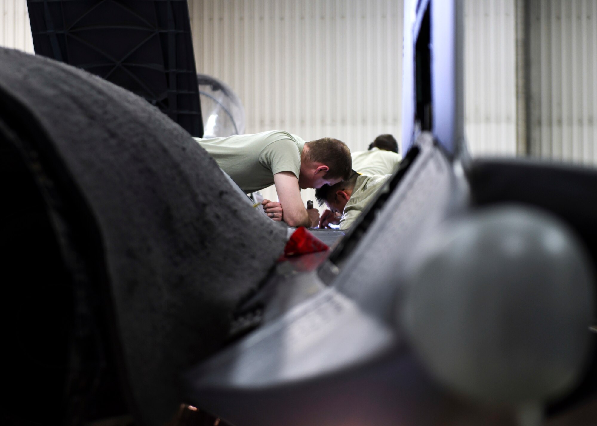 48th Maintenance Group maintainers work on the top of an F-15E Strike Eagle during a phase inspection at Royal Air Force Lakenheath, England, Jan. 10, 2019. The nine-day-long inspection is conducted by Airmen from several squadrons within the 48th MXG. (U.S. Air Force photo by Senior Airman Malcolm Mayfield)