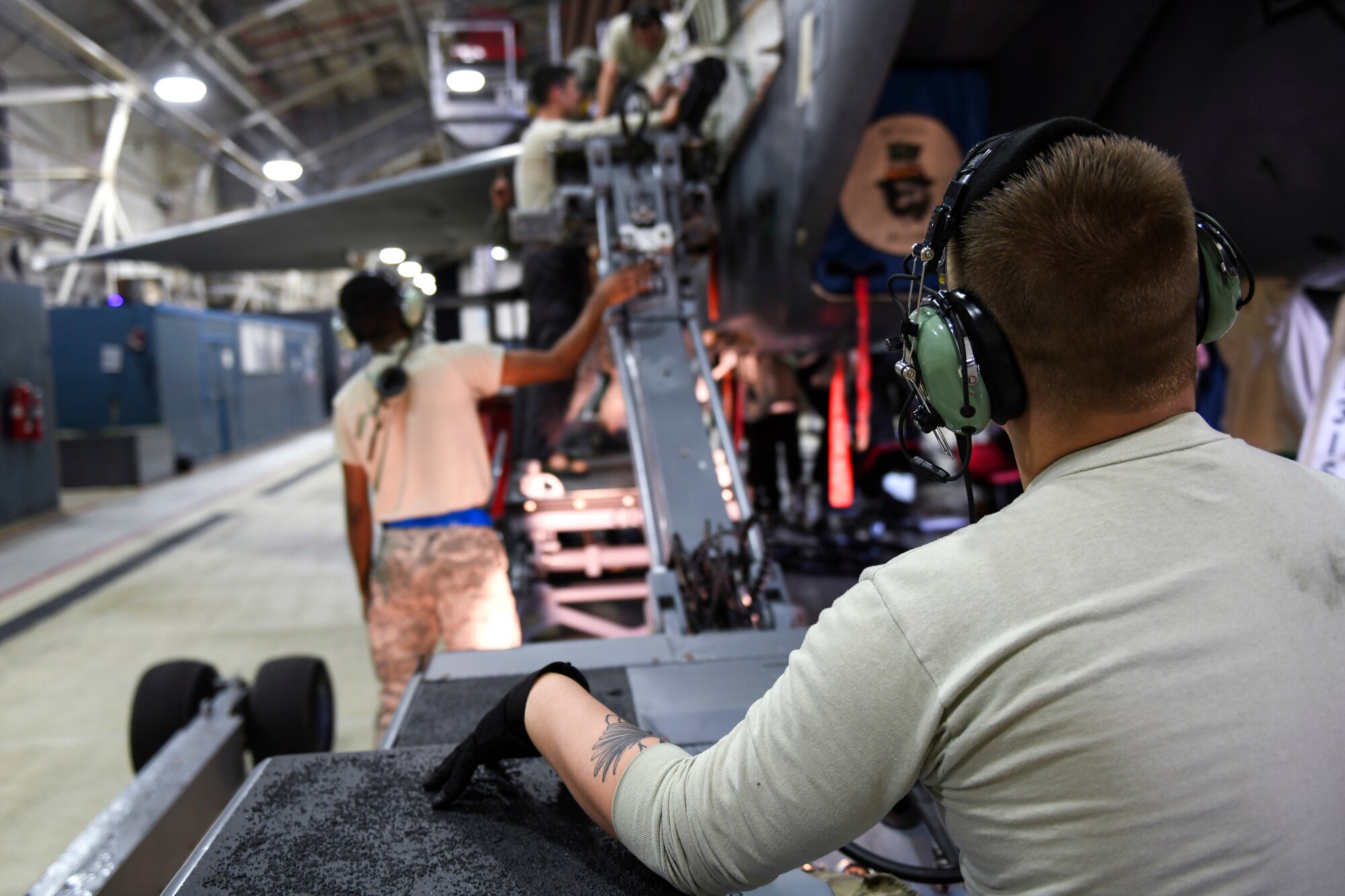 48th Maintenance Group maintainers mount a gatling gun on an F-15E Strike Eagle during a phase inspection at Royal Air Force Lakenheath, England, Jan. 10, 2019. Various parts of the F-15 are regularly inspected for discrepancies, big and small, ensuring the aircraft can perform as good as new. (U.S. Air Force photo by Senior Airman Malcolm Mayfield)