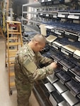 Tech. Sgt. Jeremy Armstrong, 502d Communications Squadron Cyber Transport systems technician, wires a new telephone connection at Joint Base San Antonio-Lackland, Texas. The 502d Communications Squadron handles approximately 42,000 tickets a year ranging from network concerns, phone problems and communications systems challenges.