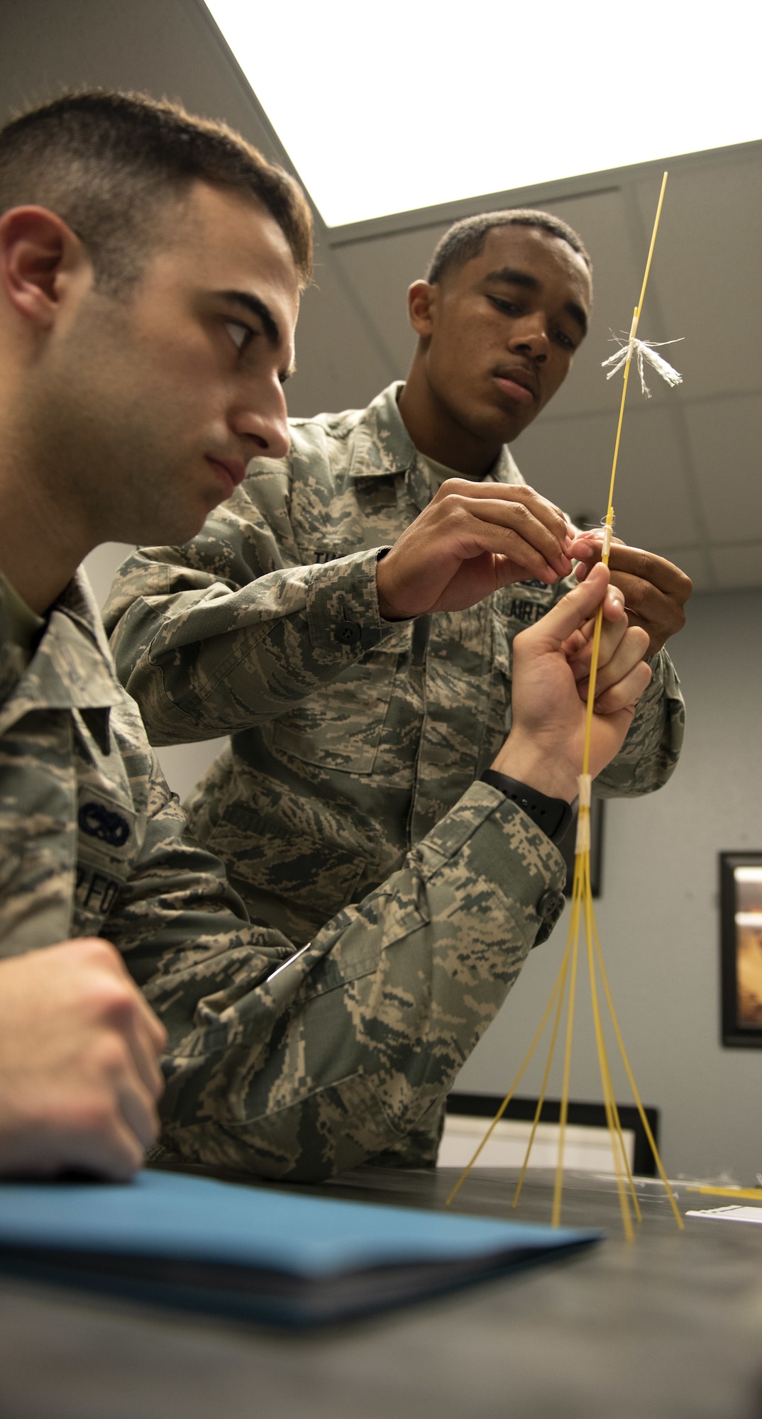 Airman 1st Class Resean Thomas, 60th Aircraft Maintenance Squadron C5 communications navigation apprentice, right, works with Airman 1st Class Mike Sobeck, 60th MXS C5 crewchief, during a competition with the First Term Airman Course class Jan. 10, 2019, at Travis Air Force Base, Calif. Airmen attend FTAC to help transition from the technical training atmosphere to the operational Air Force. (U.S. Air Force photo by Airman 1st Class Jonathon Carnell)