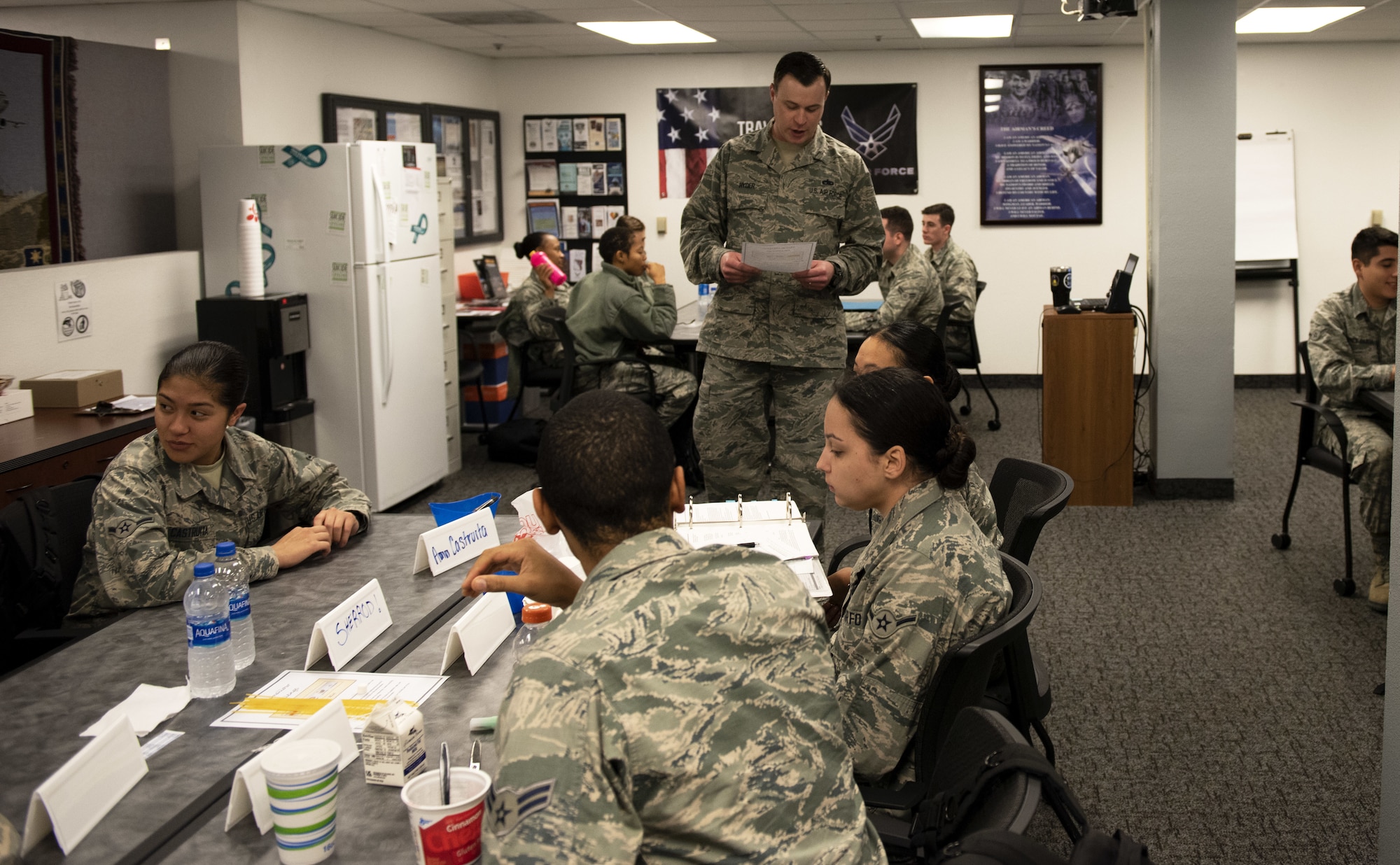 U.S. Air Force Tech. Sgt. Nathaniel Hyder, 821st Contingency Response Support Squadron equipment technician, instructs Airmen who are in the First Term Airman Course class Jan. 10, 2019, at Travis Air Force Base, Calif. Hyder is the FTAC team lead where he oversees Airmen who are transitioning from the technical training atmosphere to the operational Air Force. (U.S. Air Force photo by Airman 1st Class Jonathon Carnell)
