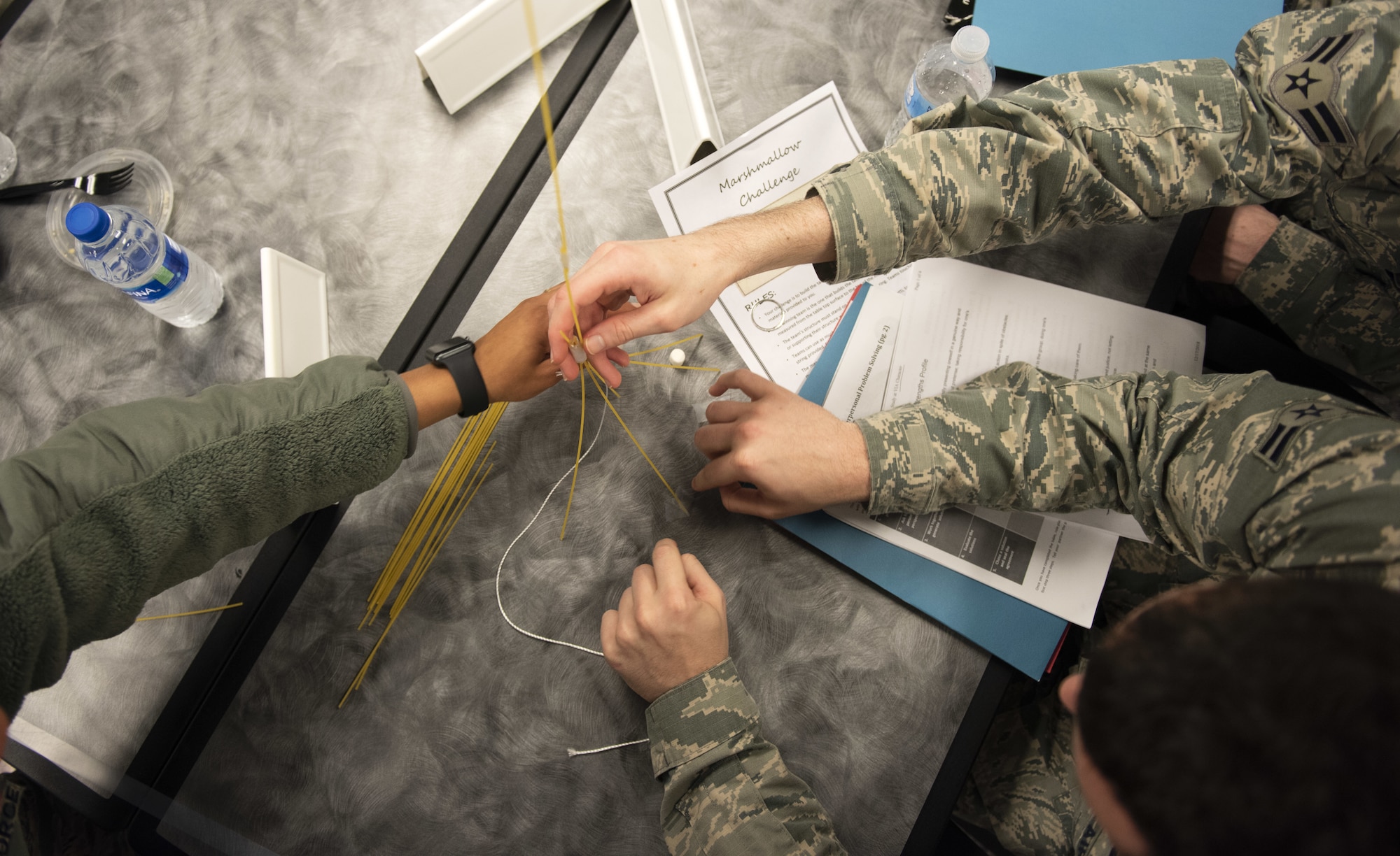 Airmen in the First Term Airman Course class work together during a competition Jan. 10, 2018, at Travis Air Force Base, Calif. Airmen attend FTAC to help transition from the technical training atmosphere to the operational Air Force. (U.S. Air Force photo by Airman 1st Class Jonathon Carnell)