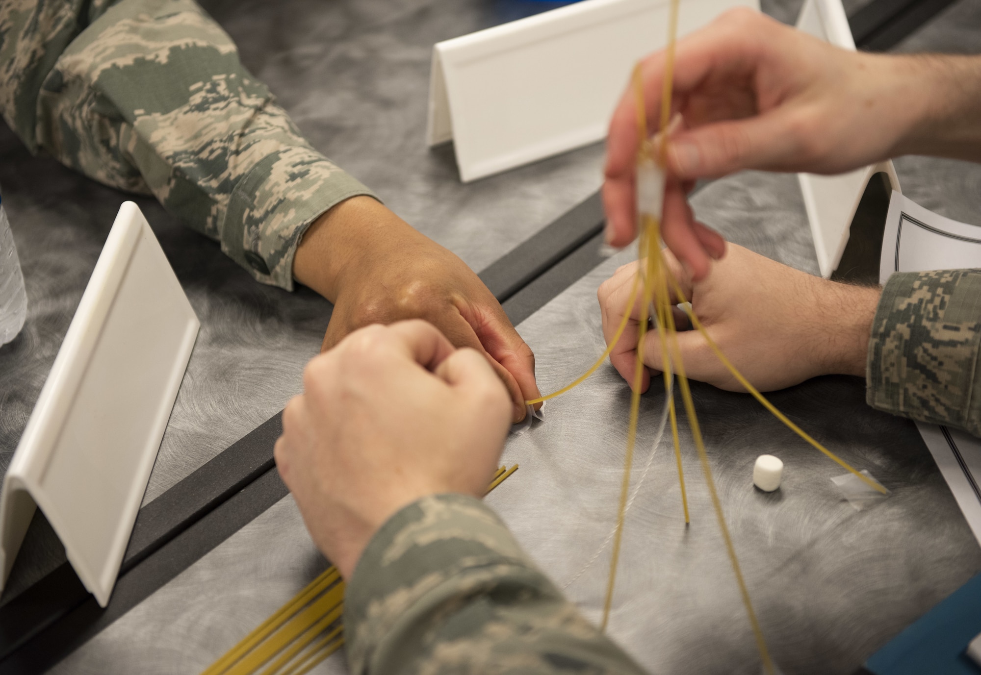Airmen in the First Term Airman Course class work together during a competition Jan. 10, 2018, at Travis Air Force Base, Calif. Airmen attend FTAC to help transition from the technical training atmosphere to the operational Air Force. (U.S. Air Force photo by Airman 1st Class Jonathon Carnell)