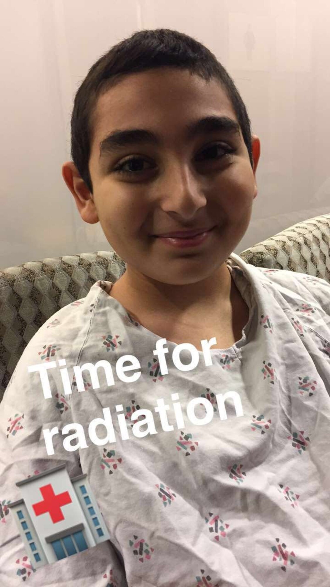 Jeremiah Harutyunyan poses for photos before a radiation therapy session.  Nine months after the treatments began, Jeremiah was diagnosed with radiation damage to the spinal cord.  He is now undergoing hyperbaric oxygen therapy treatment at the David Grant USAF Medical Center at Travis AFB, Calif., in an effort to halt, or at least, stop the rate of damage before it reaches his brain.  (Courtesy photo)