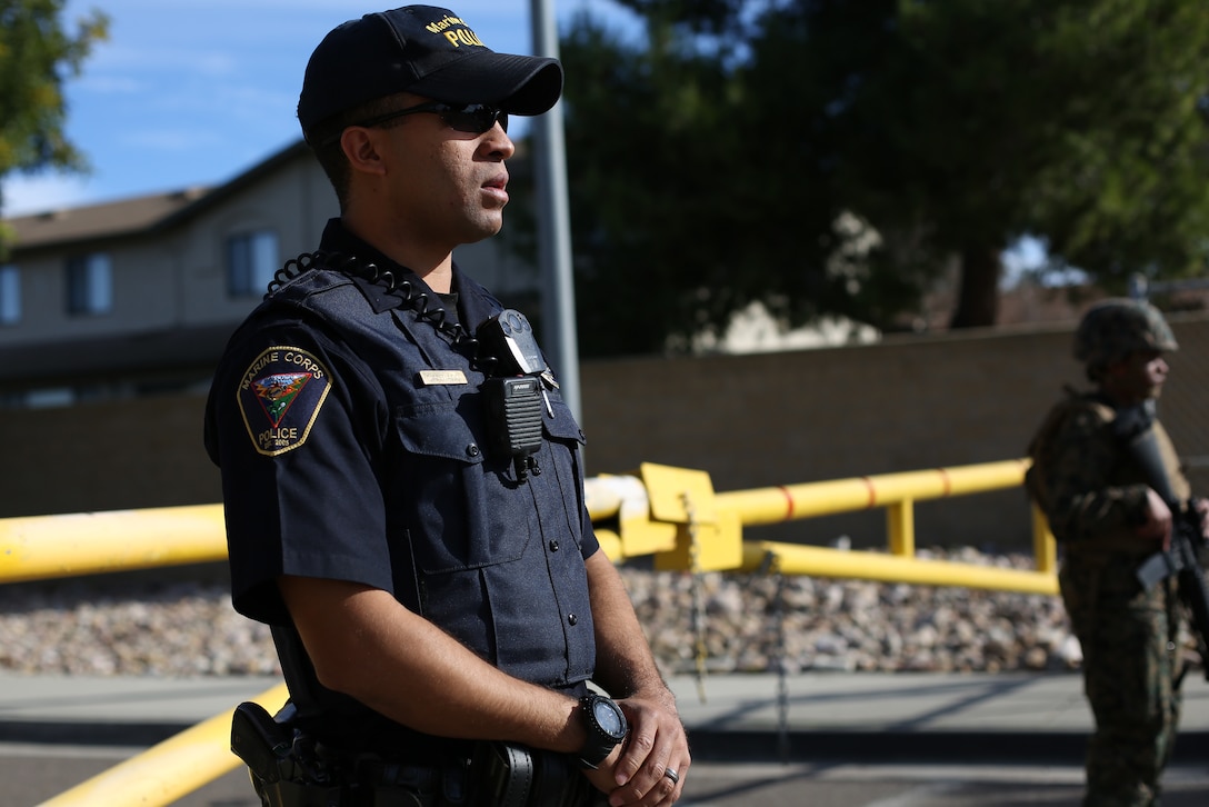 Officer Emanuel Santiago, a Marine Corps police officer at Marine Corps Air Station Miramar, blocks outgoing traffic during a base lockdown drill at MCAS Miramar, Calif., Jan. 8. MCAS Miramar’s Provost Marshall’s Office and the Security Augmentation Force (SAF) conduct routine base lockdown drills to rehearse, review and improve security procedures on the installation. (U.S. Marine Corps photo by Sgt. Jake M.T. McClung)