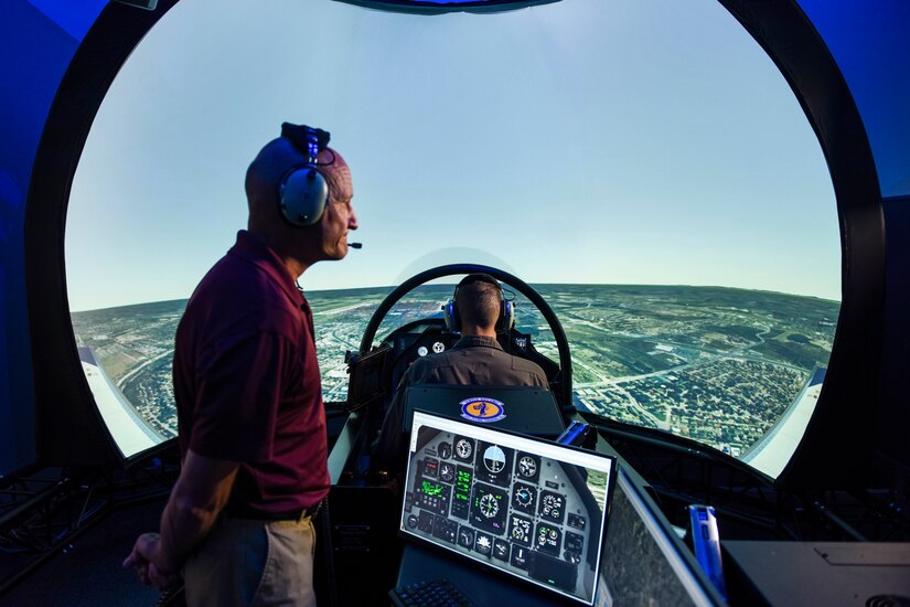 Instructor pilot monitors a training simulator flight.