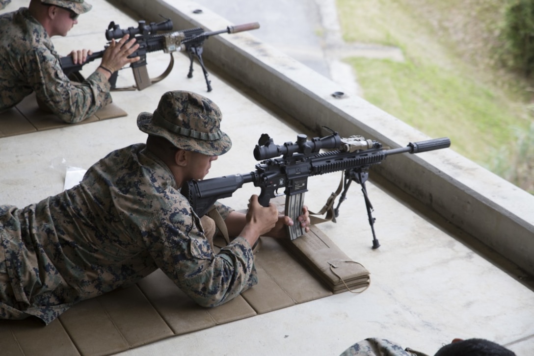 Lance Cpl. Nicholas Lozanosanchez, a designated marksman and rifleman with Charlie Company, Battalion Landing Team, 1st Battalion, 4th Marines, loads an M38 designated marksman rifle during training at Camp Hansen, Okinawa, Japan, Jan. 9, 2019. Designated marksmen and machine gunners with Charlie Company fired more than 13,000 rounds during the training, refining their abilities with the M240B medium machine gun and M38 designated marksman rifle as part of BLT 1/4, the Ground Combat Element for the 31st Marine Expeditionary Unit. The 31st MEU, the Marine Corps’ only continuously forward-deployed MEU, provides a flexible and lethal force ready to perform a wide range of military operations as the premier crisis response force in the Indo-Pacific region. (U.S. Marine Corps photo by Lance Cpl. Dylan Hess/Released)