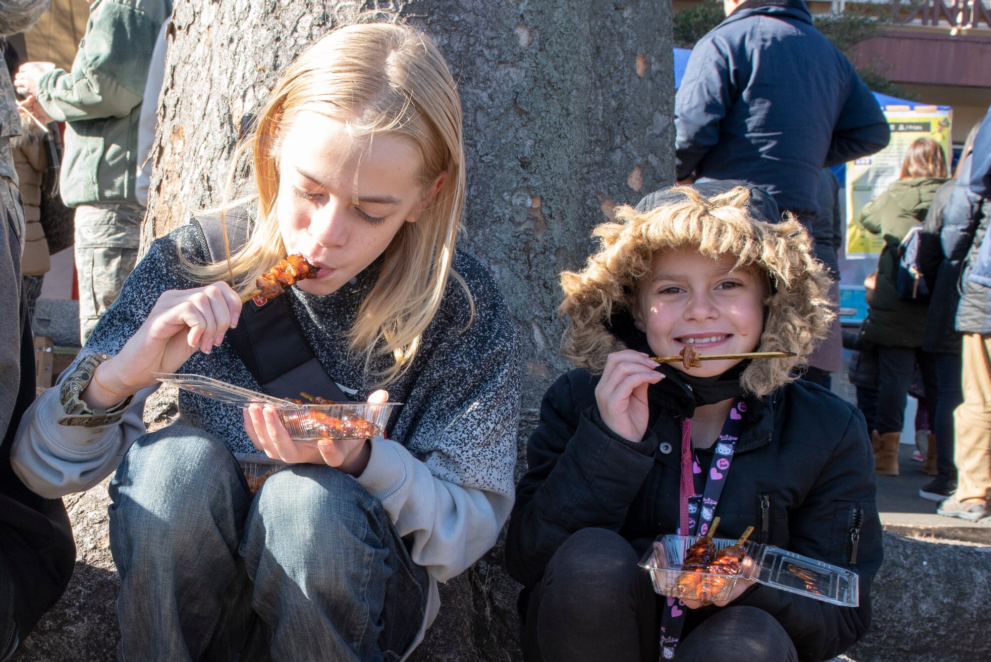 Members of Team Yokota enjoy yakitori, a traditional Japanese meal cooked over a charcoal fire, at the annual Japanese Culture Day at Yokota Air Base, Japan, Jan. 11, 2019.