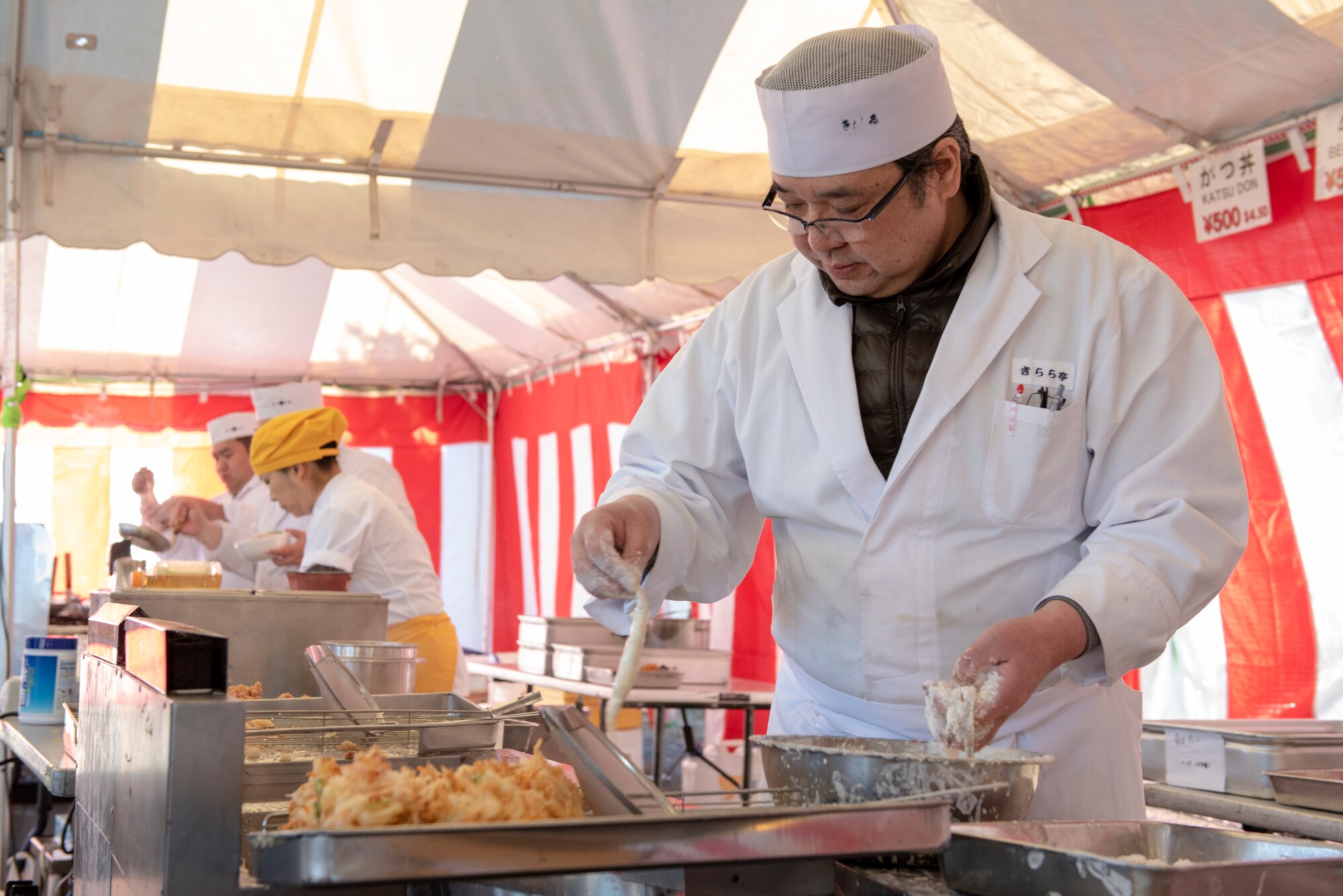 A member of the Japanese Welfare Association prepares food for the annual Japanese Culture Day at Yokota Air Base, Japan, Jan. 11, 2019.