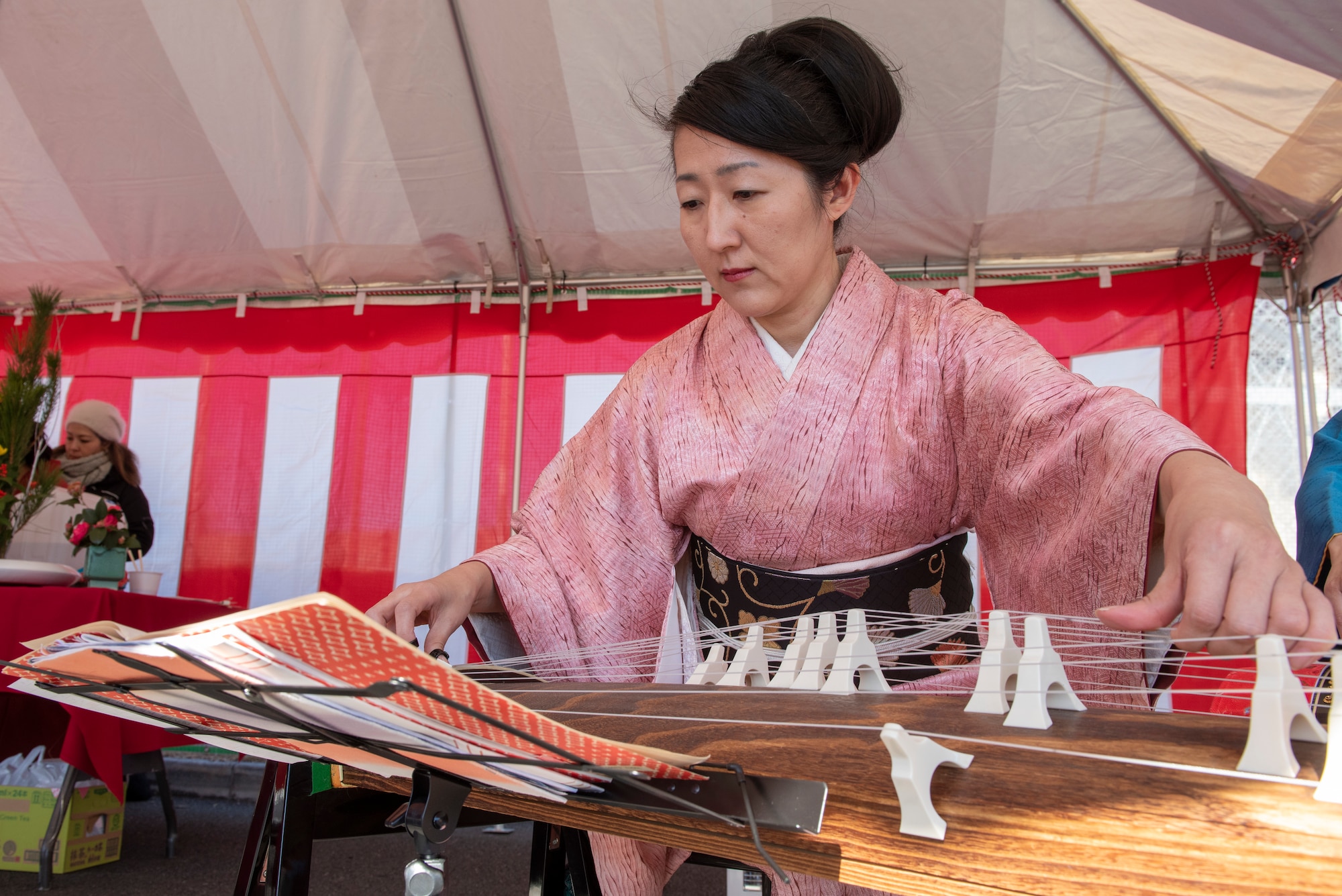 A musician plays the koto, a traditional Japanese stringed instrument at the annual Japanese Culture Day at Yokota Air Base, Japan, Jan. 11, 2019.