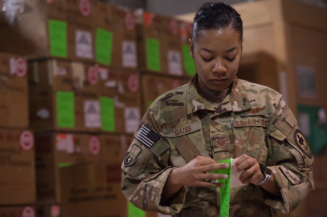 Staff Sgt. Jasmine Gates, 379th Expeditionary Aeromedical Evacuation Squadron aeromedical evacuation technician, labels boxes used to transport blood in the Blood Transshipment Center (BTC) Jan. 9, 2019, at Al Udeid Air Base Qatar. Gates volunteered time to assist Airmen at the BTC in preparing blood products for transport. The BTC is comprised of a four-person team that orchestrates the flow of blood and platelet products to 72 forward operating locations and eight mobile field surgical teams throughout U.S. Central Command’s area of responsibility. (U.S. Air Force by Tech. Sgt. Christopher Hubenthal)