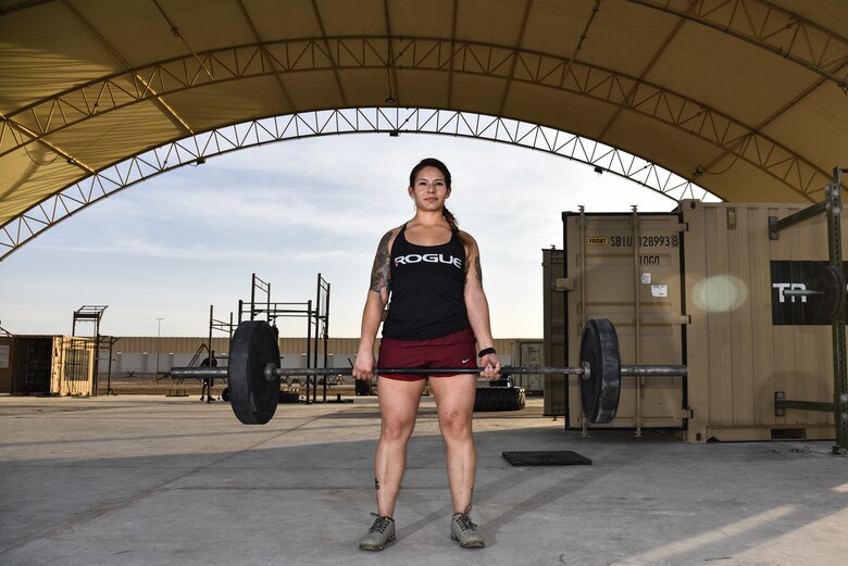 U.S. Air Force Staff Sgt. Janet Soto, 380th Expeditionary Logistics Readiness Squadron container control officer, poses for a photo at Al Dhafra Air Base United Arab Emirates, Jan. 8, 2019. Soto is one of the three Airmen from ADAB that advanced to and placed in the Strongest in the AOR competition. (U.S. Air Force photo by Senior Airman Mya M. Crosby)