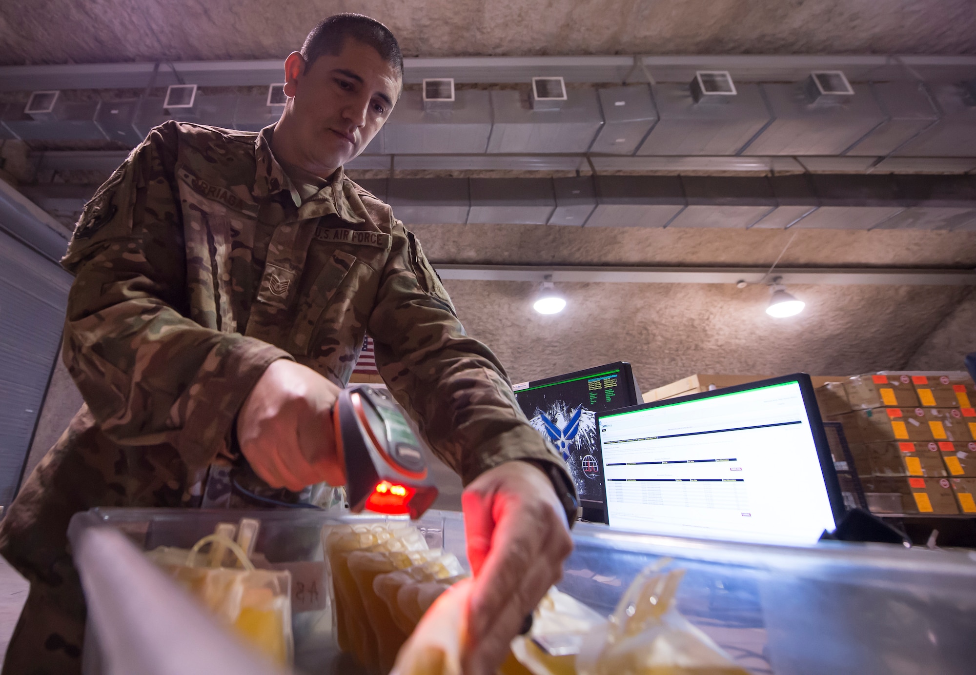 Tech. Sgt. Federico Arriaga, 379th Expeditionary Medical Group Blood Transshipment Center (BTC) logistics craftsman, scans barcodes on blood containers in the BTC Jan. 9, 2019, at Al Udeid Air Base, Qatar. The BTC is comprised of a four-person team that orchestrates the flow of blood and platelet products to 72 forward operating locations and eight mobile field surgical teams throughout U.S. Central Command’s area of responsibility. (U.S. Air Force by Tech. Sgt. Christopher Hubenthal)