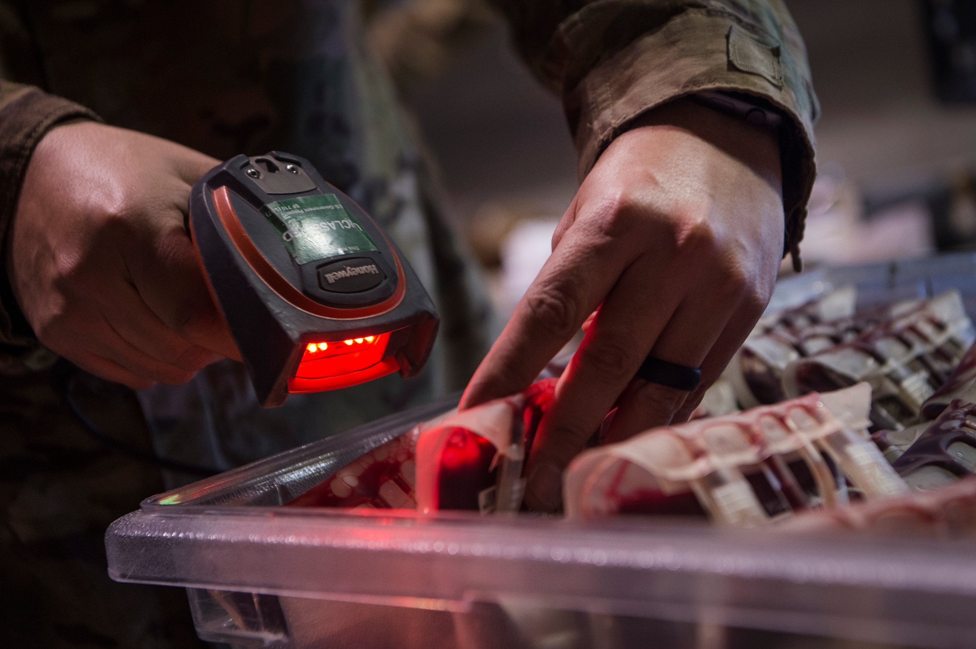 Tech. Sgt. Federico Arriaga, 379th Expeditionary Medical Group Blood Transshipment Center (BTC) logistics craftsman, scans barcodes of blood containers in the BTC Jan. 9, 2019, at Al Udeid Air Base, Qatar. The BTC is comprised of a four-person team that orchestrates the flow of blood and platelet products to 72 forward operating locations and eight mobile field surgical teams throughout U.S. Central Command’s area of responsibility. (U.S. Air Force by Tech. Sgt. Christopher Hubenthal)