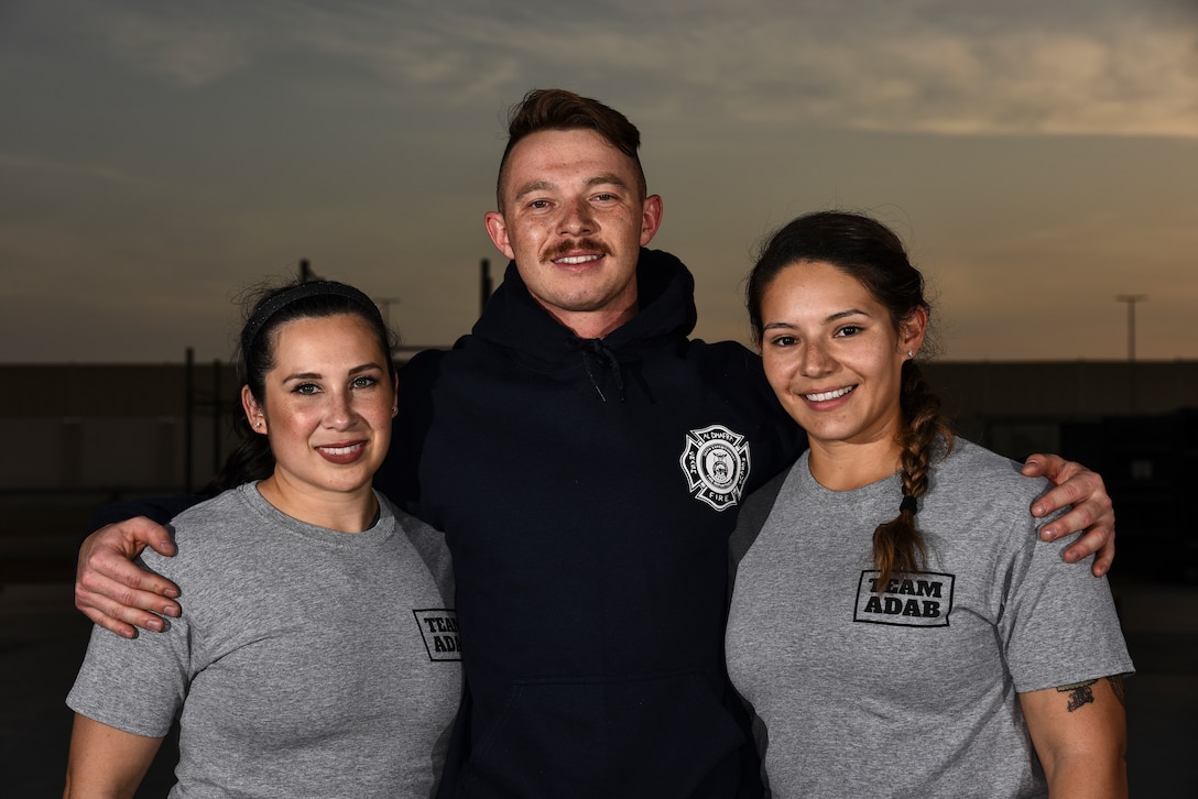 (From left to right) U.S. Air Force Master Sgt. Megan Bender, 727th Expeditionary Air Control Squadron weapons director; Staff Sgt. Nathaniel Roark, 380th Expeditionary Civil Engineer Squadron firefighter; and Staff Sgt. Janet Soto, 380th Expeditionary Logistics Readiness Squadron container control officer, pose for a photo at Al Dhafra Air Base United Arab Emirates, Jan. 8, 2019. The Airmen competed against 143 others from bases such as Bagram Airfield, Afghanistan, and Ali Al Salem Air Base, Kuwait, in the Strongest in the AOR competition. (U.S. Air Force photo by Senior Airman Mya M. Crosby)