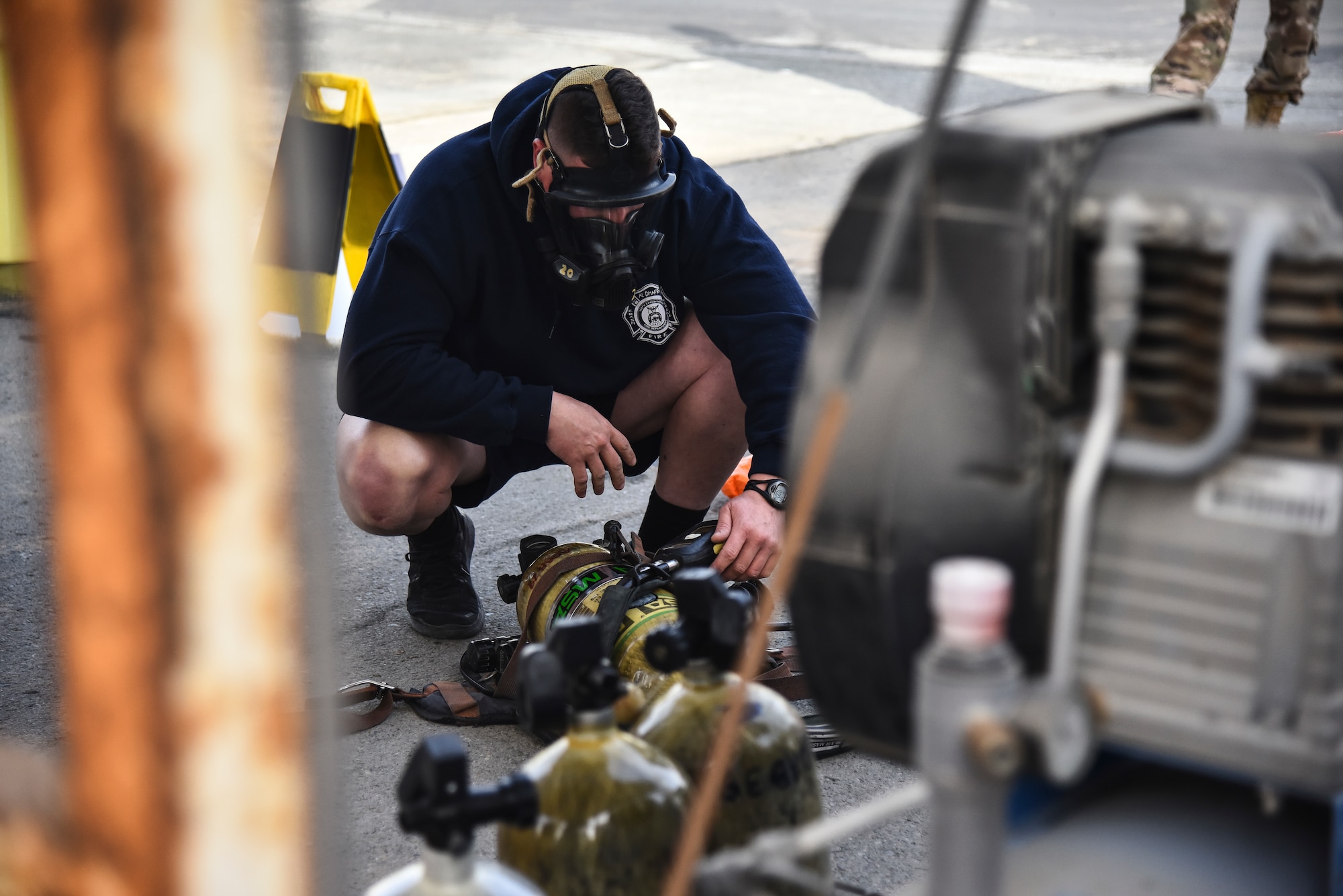 U.S. Air Force Senior Master Sgt. Nicholas Ward, 380th Expeditionary Civil Engineer Squadron Fire Department deputy fire chief, performs an operational check on his self-contained breathing apparatus during a hazardous materials exercise at Al Dhafra Air Base, United Arab Emirates, Jan. 4, 2019. The 380th ECES Fire Department and Emergency Management flights conducted a joint-agency hazardous material exercise for training purposes. (U.S. Air Force photo by Senior Airman Mya M. Crosby)