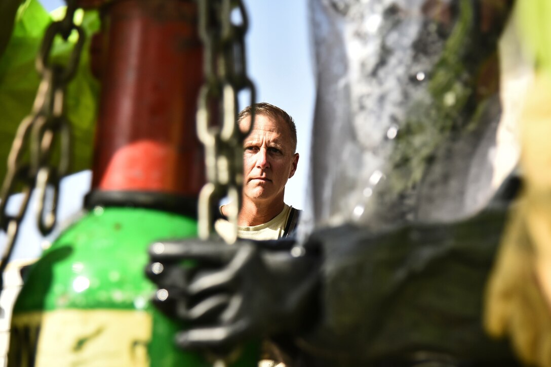 U.S. Air Force Master Sgt. Michael Whaley, 380th Expeditionary Civil Engineer Squadron Fire Department Station #2 station captain, supervises Airmen from the 380th ECES Emergency Management flight during a hazardous materials exercise at Al Dhafra Air Base, United Arab Emirates, Jan. 4, 2019. The 380th ECES Fire Department and Emergency Management flights conducted a joint-agency hazardous material exercise for training purposes. (U.S. Air Force photo by Senior Airman Mya M. Crosby)