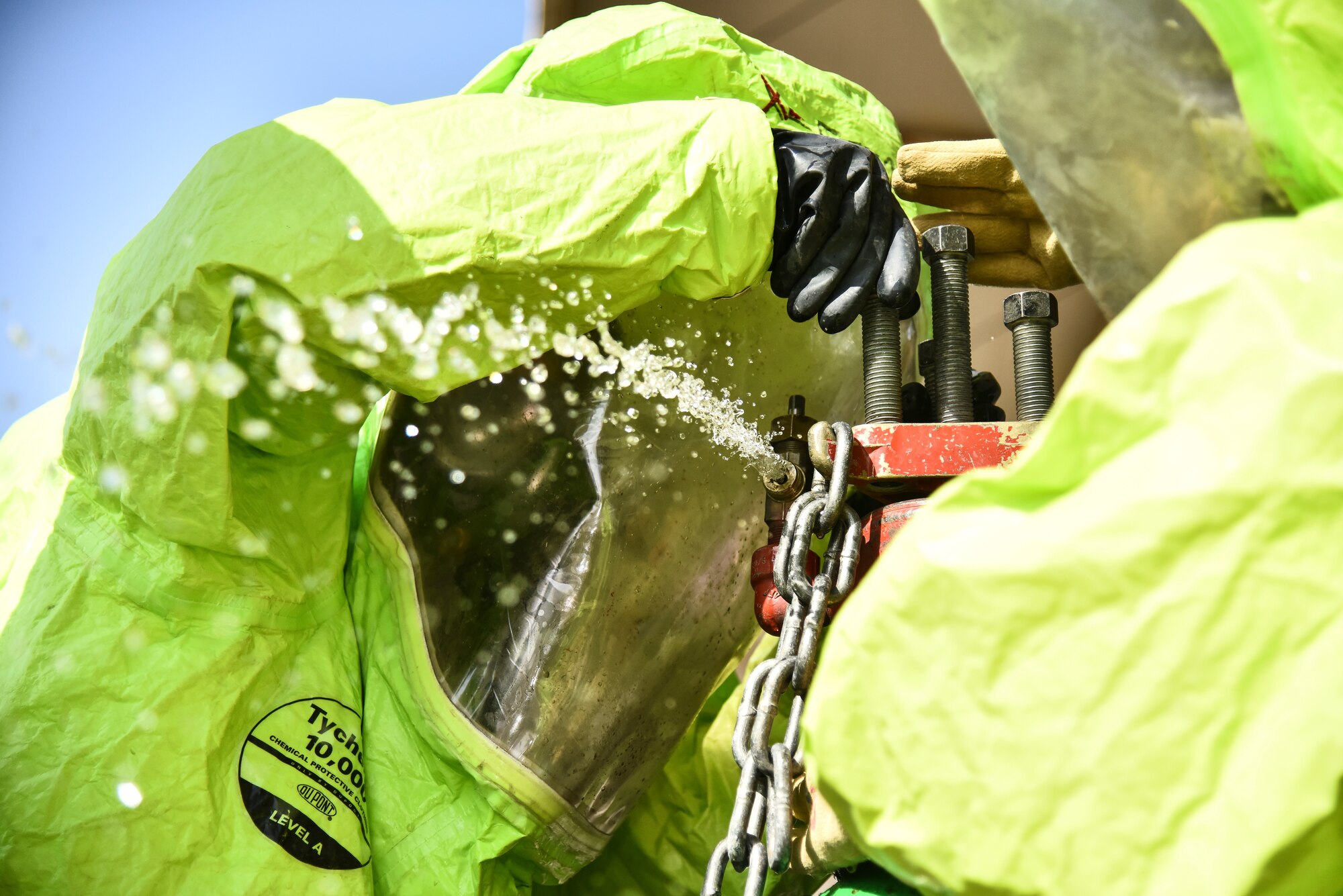 U.S. Airmen assigned to the 380th Expeditionary Civil Engineer Squadron Emergency Management flight cap a leaking gate valve of a simulated pressurized chlorine cylinder during a hazardous materials exercise at Al Dhafra Air Base, United Arab Emirates, Jan. 4, 2019. The exercise was designed to be a Department of Defense certification for three Airmen in the fire department and an annual refresher training for the EM flight. The Airmen were instructed to contain leaks on a pressurized chlorine cylinder, a one-ton cryo-tank, and a rail car, all after donning a Level-A suit. (U.S. Air Force photo by Senior Airman Mya M. Crosby)