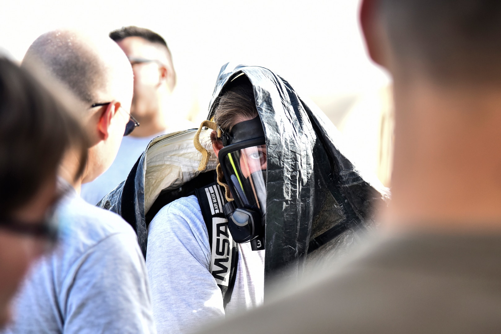 U.S. Air Force Senior Airmen Sarah Howell, 380th Expeditionary Civil Engineer Squadron emergency management journeyman, dons a Level-A suit during a hazardous materials exercise at Al Dhafra Air Base, United Arab Emirates, Jan. 4, 2019. The 380th ECES Fire Department and Emergency Management flights conducted a joint-agency hazardous material exercise for training purposes. (U.S. Air Force photo by Senior Airman Mya M. Crosby)