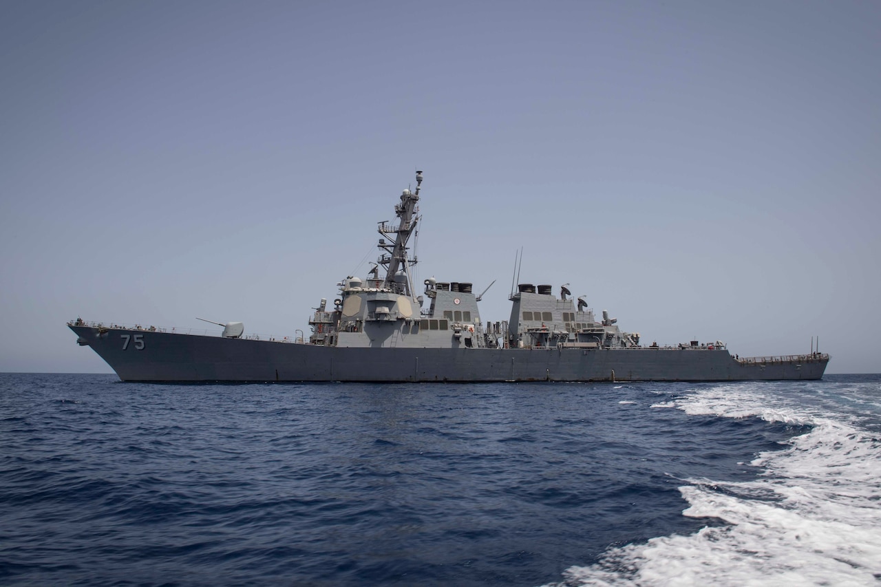 An ocean view of a guided-missile destroyer.