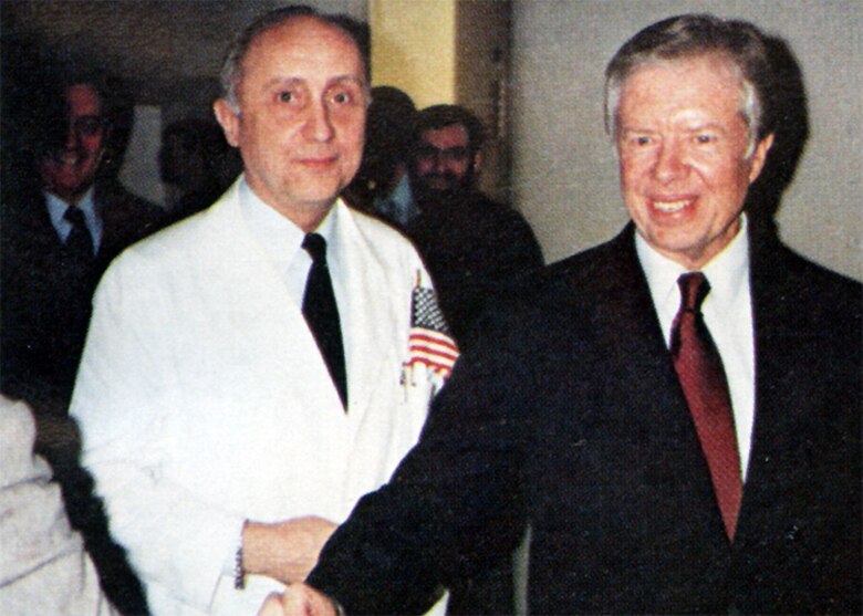 U.S. Air Force Col. Frederick W. Plugge escorts former President Jimmy Carter while he greets the newly freed hostages at the U.S. Air Force Hospital in Wiesbaden, Germany, Jan. 21, 1981. The hostages received medical and psychological exams at the hospital before returning home to the U.S. (U.S. Air Force photo)