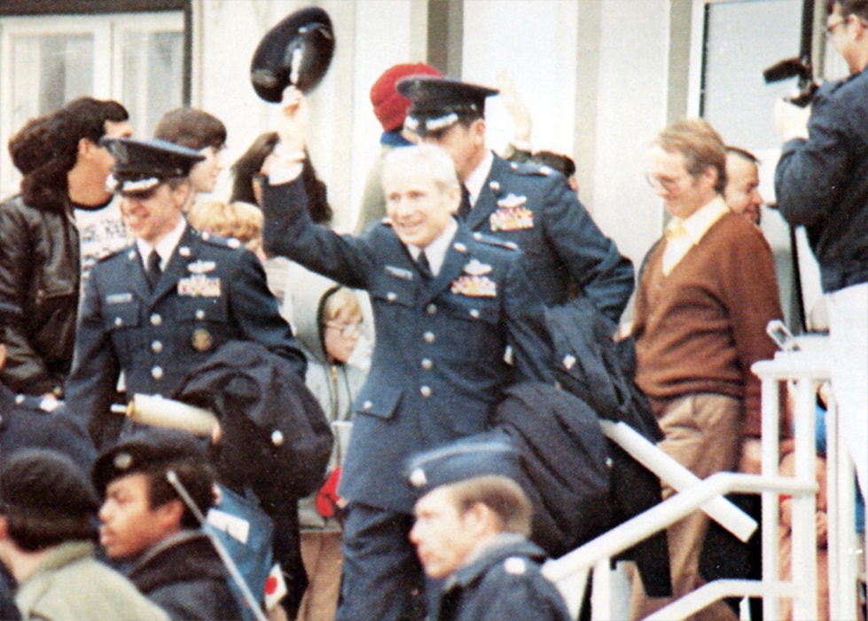 U.S. Air Force Col. Thomas E. Schaefer, ranking military officer among the former Iranian hostages, doffs his service cap to the cheering crowd as he departs the U.S. Air Force Hospital in Wiesbaden, Germany, Jan. 20, 1981. His next stop: the United States of America. (U.S. Air Force photo)