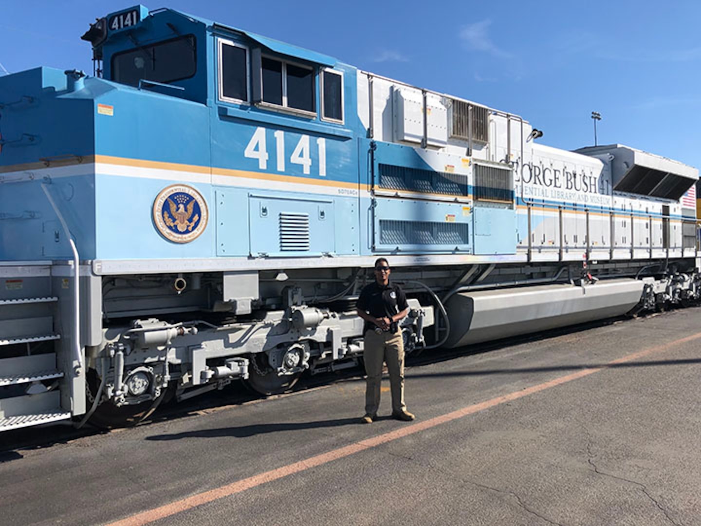 Master Sgt. Shana Cobbs in front of the George Bush 4141 Locomotive Dec. 3, 2018, in Spring, Texas Cobbs provided security for the locomotive during the Bush funeral detail, securing the areas prior to arrival at each location.