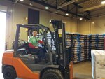 Man driving forklift