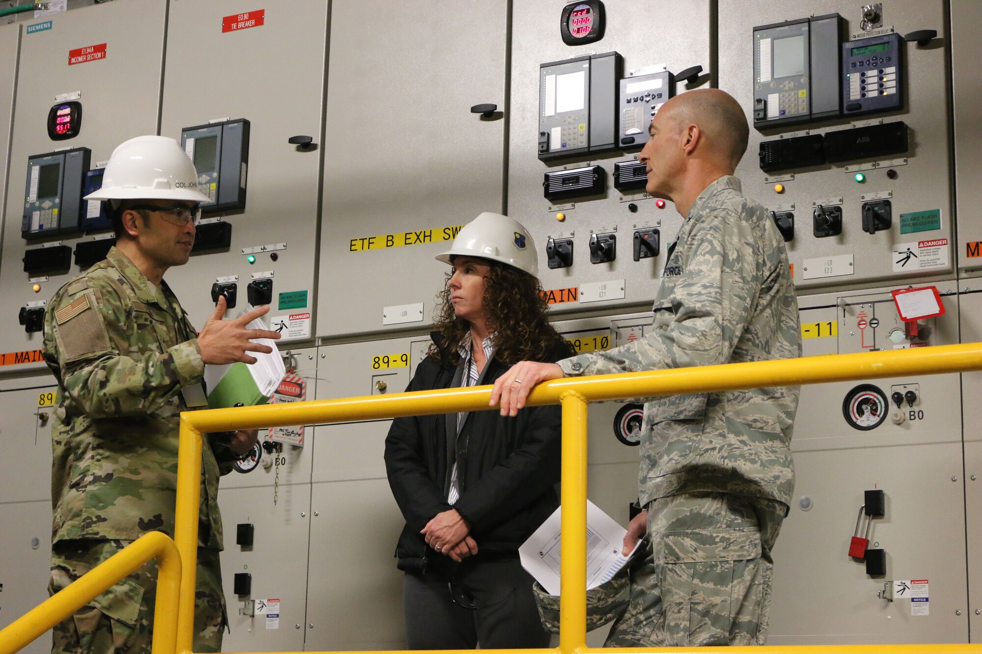 AEDC Test Systems Sustainment Chief Col. John Tran, left, and TSS Capital Improvement Lead Engineer and Service Life Extension Program Manger Kathleen Bajar show Brig. Gen. Christopher Azzano, commander of the Air Force Test Center, the mechanical systems used in the Engine Test Facility at Arnold Air Force Base. Azzano and other AFTC leadership visited Arnold Air Force Base in mid-November to take part in the 2018 AFTC Strategic Offsite, Azzano’s first offsite since assuming the role of AFTC commander in August. (U.S. Air Force photo by Brad Hicks) (This image was altered by obscuring badges for security purposes)