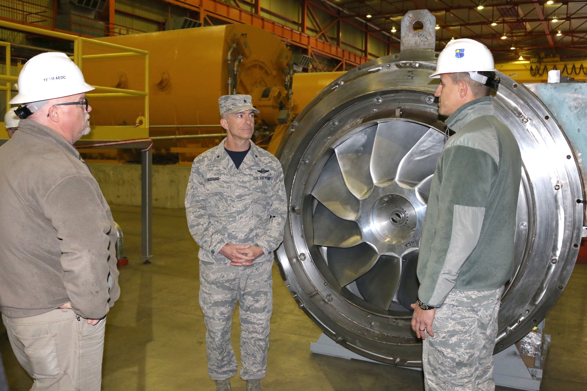 Lt. Col. David Garay, director of the Aeropropulsion Combined Test Force at Arnold Air Force Base, right, discusses some of the equipment found within the Aeropropulsion Systems Test Facility with Brig. Gen. Christopher Azzano, commander of the Air Force Test Center, center. Pictured at left is ASTF Asset Manager Jimmy Steele. Azzano and other AFTC leadership visited Arnold Air Force Base in mid-November to take part in the 2018 AFTC Strategic Offsite, Azzano’s first offsite since assuming the role of AFTC commander in August. (U.S. Air Force photo by Brad Hicks)