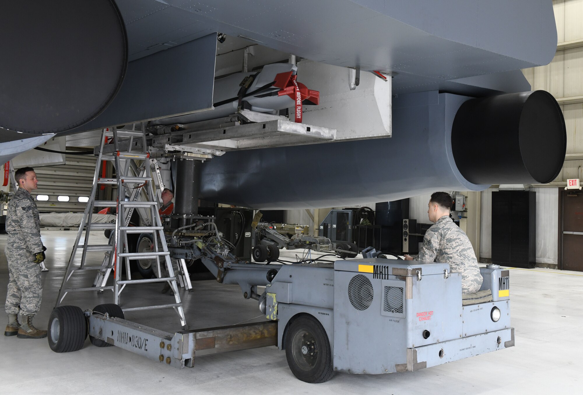 Load crew members from the 34th Aircraft Maintenance Unit use a munition truck or ‘jammer’, to load an inert AGM-158 Joint Air-to-Surface Standoff Missile into a simulated B-1 Bomber at the annual weapons load competition at Ellsworth Air Force Base, S.D., Jan.7, 2019. Squadron leadership selected weapons loaders to represent each unit as the best load crew of 2018. (U.S. Air Force photo by Airman 1st Class Christina Bennett)