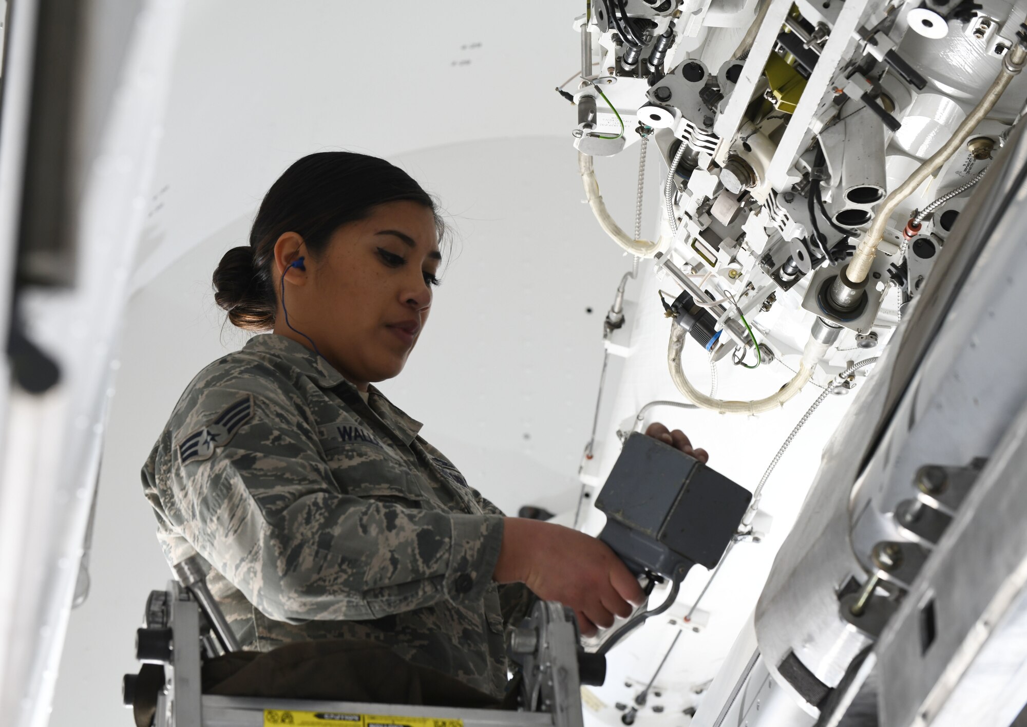 Senior Airman Andrea Walls, a 28th Munitions Squadron load crew member, loads an inert AGM-158 Joint Air-to-Surface Standoff Missile onto a simulated B-1 bomber at the annual weapons load competition at Ellsworth Air Force Base, S.D., Jan. 7, 2019. The JASSM weighs 2,250 pounds and must be lifted approximately 17 feet in the air to be inserted into the bomb bay of the simulated B-1. (U.S. Air Force photo by Airman 1st Class Christina Bennett)