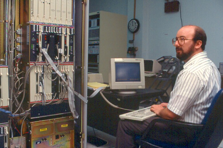 An AFC4A civilian technician performs equipment tests in the Technology Integration Center at Scott AFB, Illinois, 30 Aug 1993. 
(Courtesy of the AFNIC History Office)
