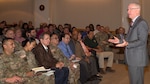 Stuart Hazlett (right) discusses topics to include procurement support, data analytics and talent management with civilian and uniformed members of the contracting workforce during a town hall Jan. 9 at Joint Base San Antonio-Fort Sam Houston. Taking part in the town hall were members of the Mission and Installation Contracting Command and 410th Contracting Support Brigade. Hazlett is the deputy assistant secretary of the Army for procurement.