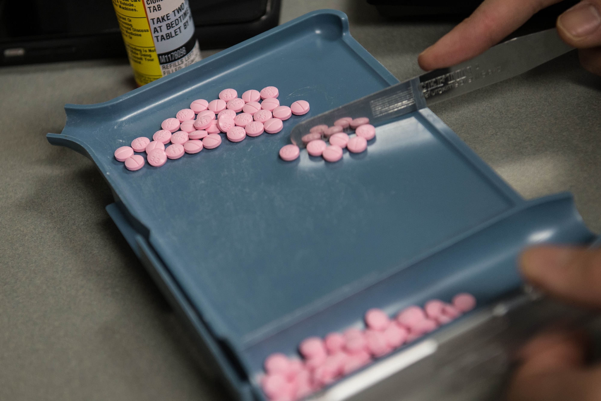 Capt. Jin Kang, 55th Medical Group pharmacist, processes medication in the Ehrling Burquist pharmacy Jan. 7, 2019, Offutt Air Force Base, Nebraska. The base pharmacy carefully screens all medications to ensure quality controlled products are correctly supplied to their patients. (U.S. Air Force photo by Zachary Hada)