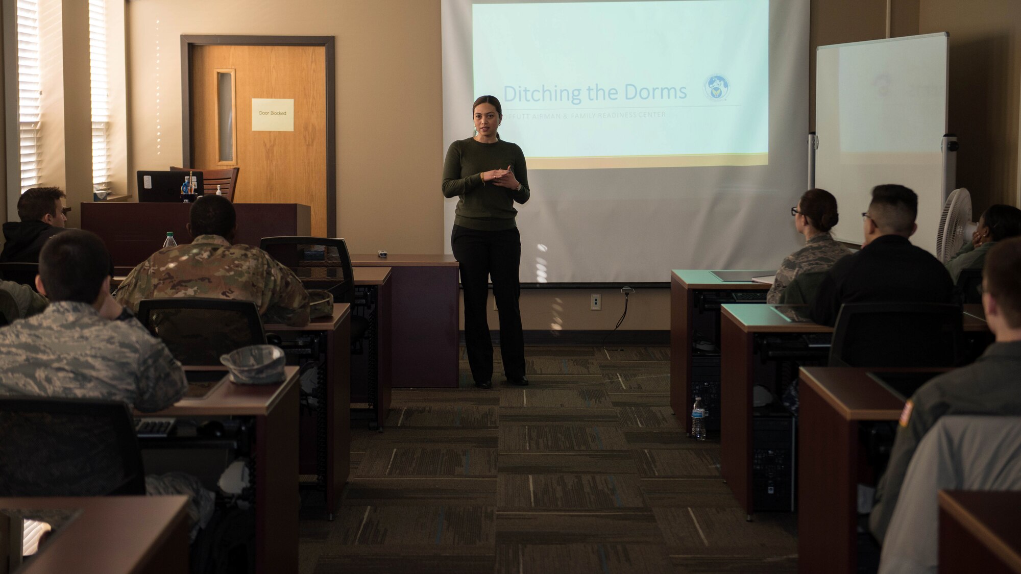 Chryzelle Cabrillas-Harris, Airman and Family Readiness Center community readiness consultant, teaches the workshop, "Ditching the Dorms," Jan. 11, 2019, at Offutt Air Force Base, Nebraska. The course helps service members moving out of the base dormitories. (U.S. Air Force photo by Zachary Hada)