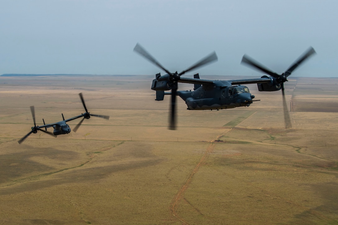 Two CV-22 Osprey aircraft fly close together
