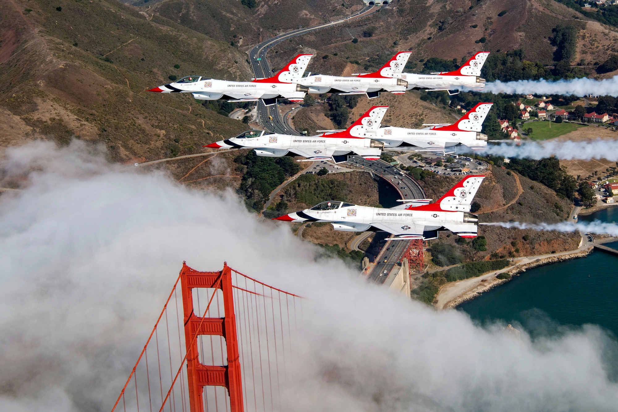 The Air Force Air Demonstration Squadron Thunderbirds Delta flies over the Golden Gate Bridge