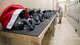 Staff Sgt. Clayton Riegle, 2nd Operations Support Squadron aircrew flight equipment NCO in charge, places helmets on a counter at Barksdale Air Force Base, La., Dec. 13, 2018. The 2nd OSS manage and maintain the equipment of over 300 air crew members. (U.S. Air Force photo by Airman 1st Class Lillian Miller)