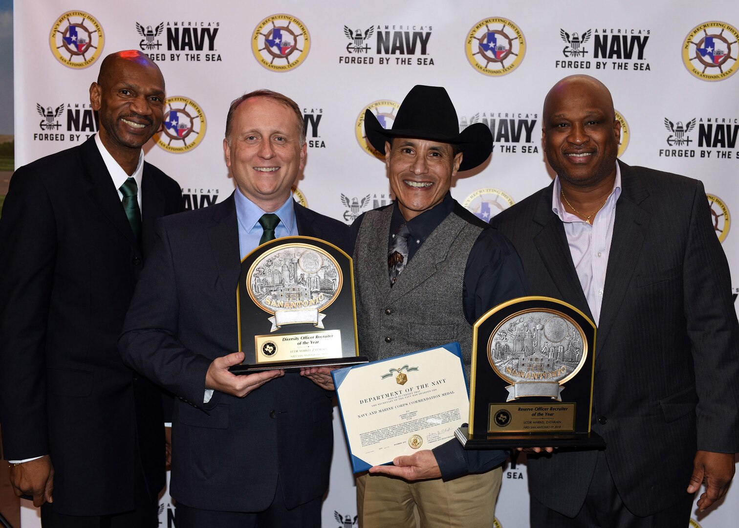 Lt. Cmdr. Markel Zatarain (third from left) of San Antonio, assigned to Navy Recruiting District (NRD) San Antonio, was recognized as the NRD’s 2018 Reserve Officer Recruiter and Diversity Officer Recruiter of the Year during an awards banquet held at the Hangar Hotel and Convention Center.  Presenting the awards were (from left) Command Master Chief Petty Officer Eric Mays, NRD Commanding Officer Cmdr. Jeffrey Reynolds, and Master Chief Petty Officer Matthew Maduemesi.