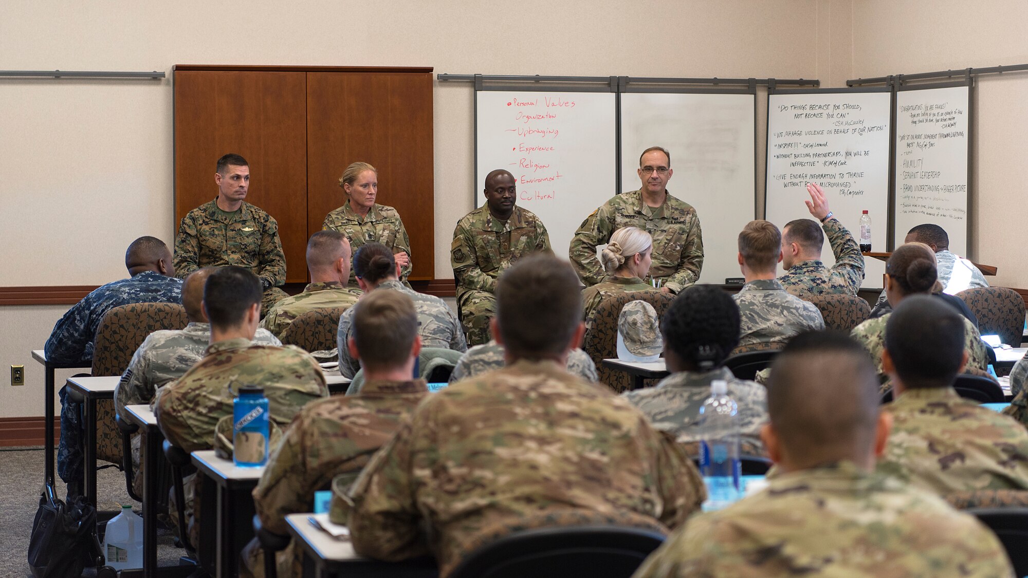 Senior enlisted leaders speak with joint non-commissioned officers during the first-ever Joint Professional Military Education course at MacDill Air Force Base, Fla., January 8, 2019. The course covered topics such as the joint perspective of each branch, cultural and ethical awareness, building partnerships, communication, and leadership.