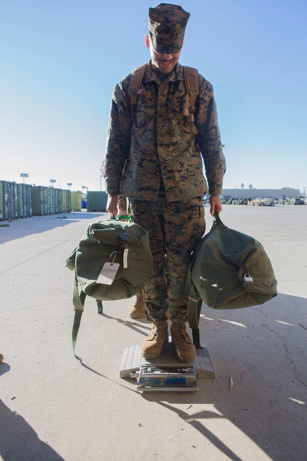 U.S. Marine Cpl. Alonso Silva, with Marine Wing Support Squadron (MWSS) 373, Marine Wing Support Group (MWSG) 37, 3rd Marine Aircraft Wing (MAW), weighs himself with his equipment prior to departure to Catalina Island from Marine Corps Air Station Miramar, Calif., Jan. 2. Weight of equipment and personnel impacts flight planning and is necessary to achieve operational excellence in troop movements. 3rd MAW and the Catalina Island Conservancy are partnered through the Innovative Readiness Training (IRT) program, which offers Marines to conduct applicable training while addressing community needs. (U.S. Marine Corps photo by Lance. Cpl. Julian Elliott-Drouin)